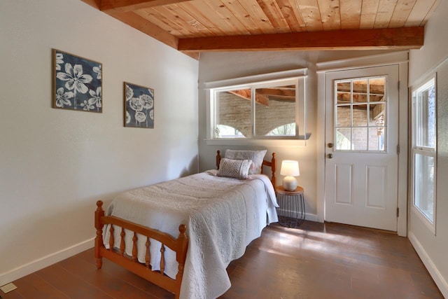 bedroom with vaulted ceiling with beams, wooden ceiling, and dark hardwood / wood-style floors