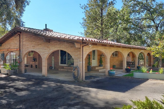 back of house with a patio