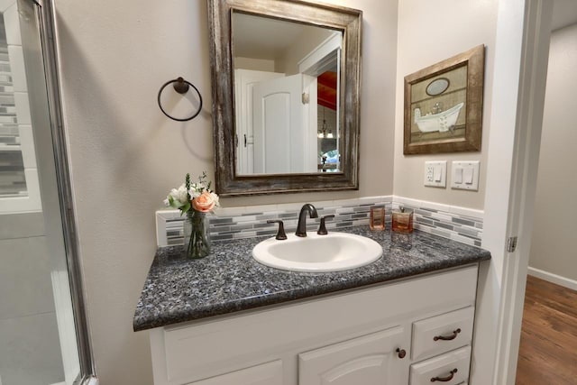 bathroom with vanity and backsplash