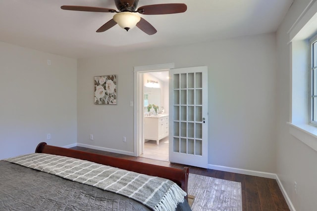 bedroom featuring ceiling fan, dark hardwood / wood-style flooring, and ensuite bath