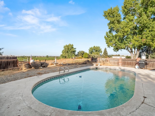 view of pool featuring fence and a fenced in pool