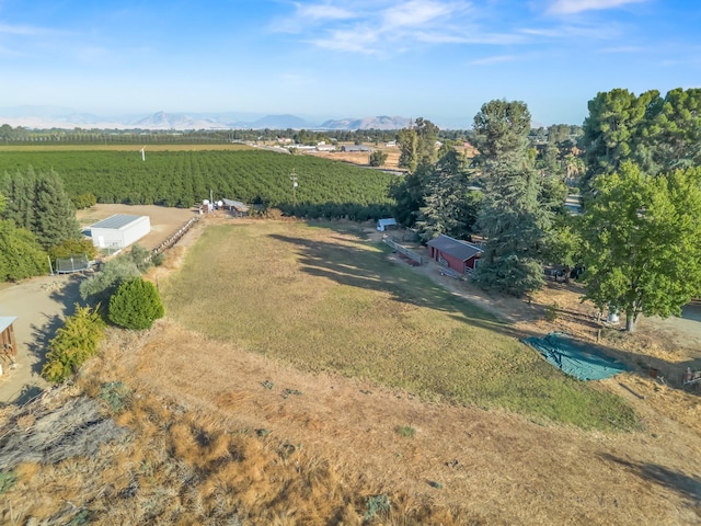 drone / aerial view with a mountain view and a rural view
