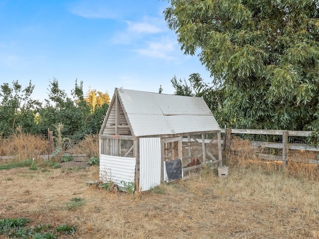 view of poultry coop featuring fence