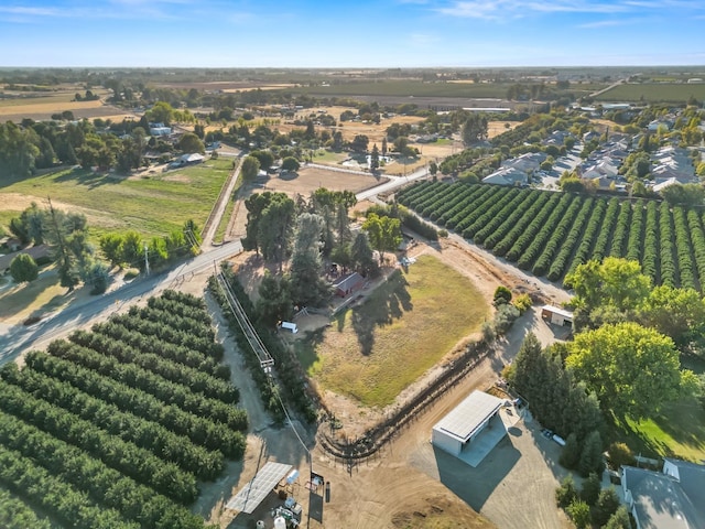birds eye view of property with a rural view