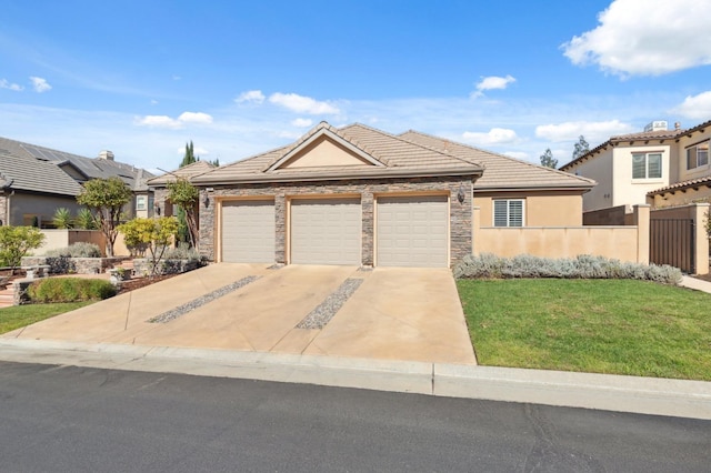 view of front of property featuring a front lawn and a garage