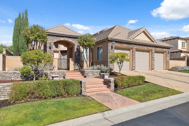 view of front of property featuring a front lawn and a garage