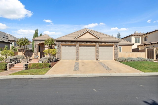 view of front of property with a garage and a front lawn