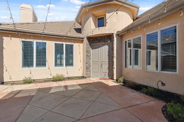 rear view of house with a patio