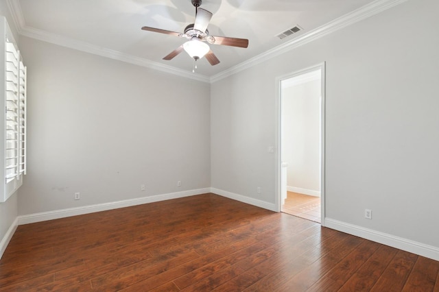 spare room featuring ornamental molding, ceiling fan, and dark hardwood / wood-style flooring