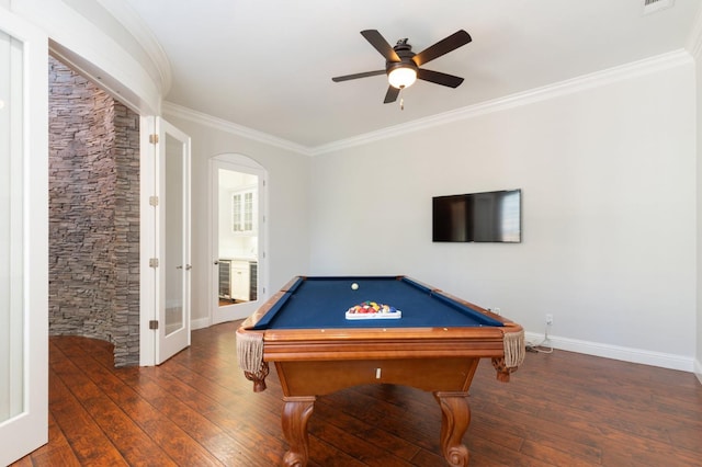 game room with ornamental molding, dark wood-type flooring, billiards, and ceiling fan