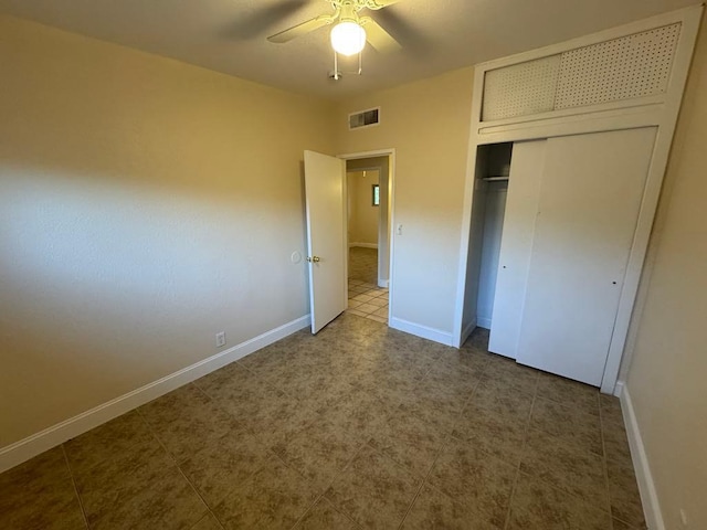 unfurnished bedroom featuring a closet and ceiling fan