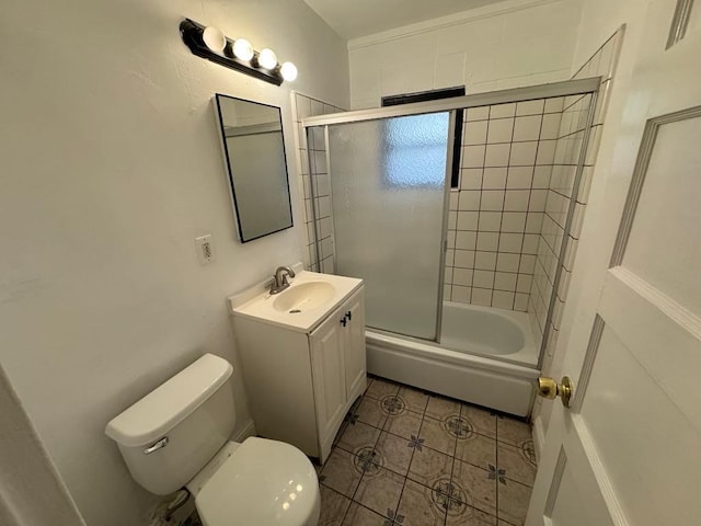 full bathroom with vanity, shower / bath combination with glass door, and toilet