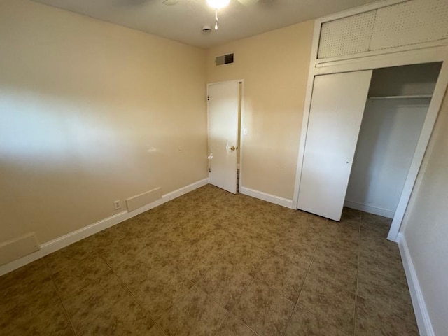 unfurnished bedroom featuring a closet