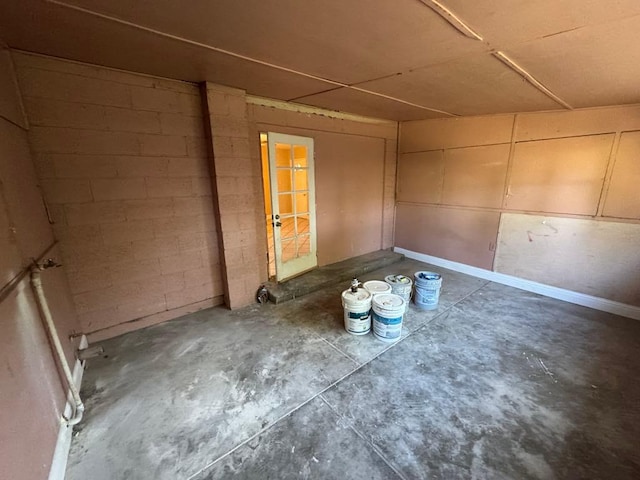 unfurnished room featuring concrete flooring