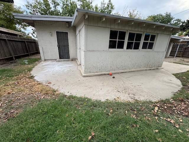 back of property with a patio