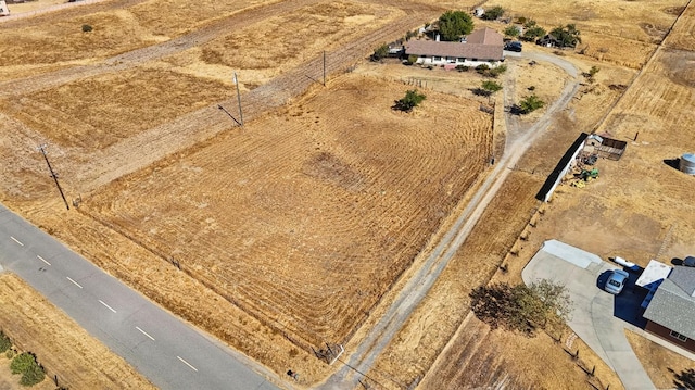 birds eye view of property featuring a rural view