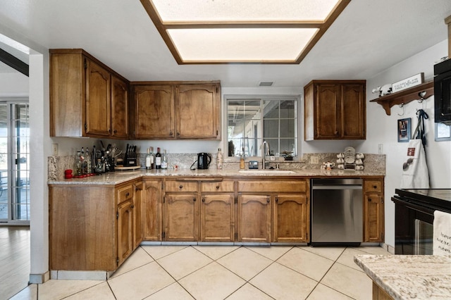 kitchen with plenty of natural light, a sink, dishwasher, and range with electric cooktop