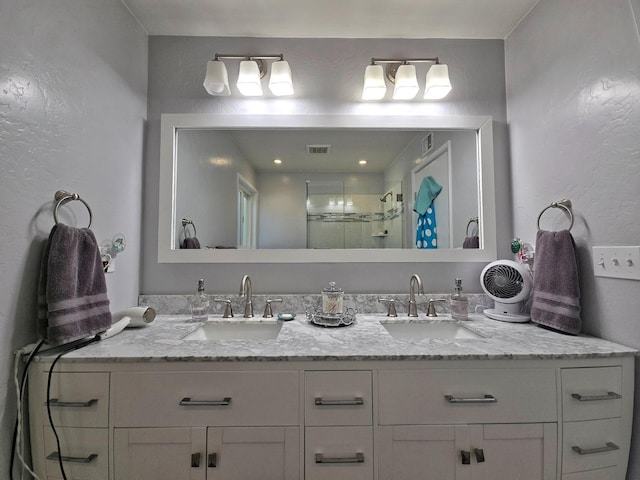 bathroom with vanity and an enclosed shower