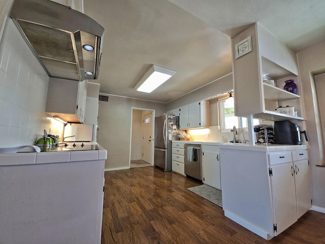 kitchen with sink, backsplash, stainless steel appliances, dark hardwood / wood-style floors, and white cabinets