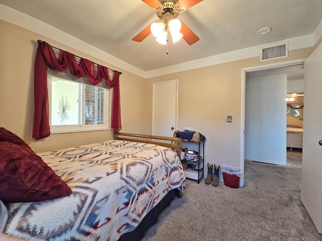 carpeted bedroom with ceiling fan