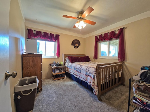 bedroom with multiple windows, carpet flooring, and ceiling fan