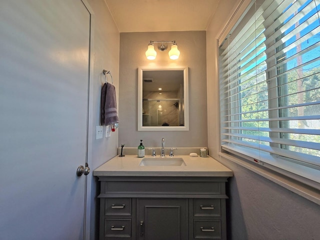 bathroom with vanity and an enclosed shower