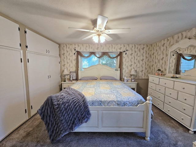 bedroom with dark carpet and ceiling fan