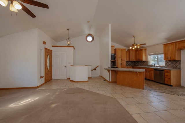 kitchen featuring hanging light fixtures, stainless steel appliances, backsplash, light tile patterned floors, and ceiling fan