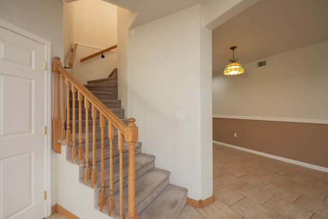 staircase with tile patterned flooring