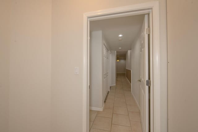 hallway featuring light tile patterned floors