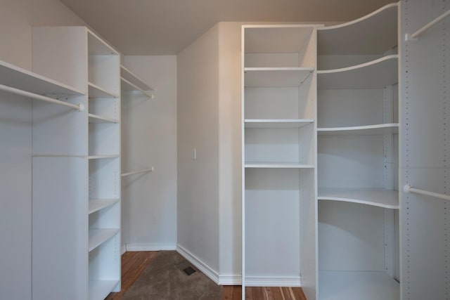 spacious closet featuring hardwood / wood-style flooring