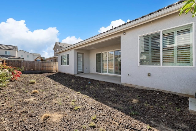 rear view of property featuring a patio