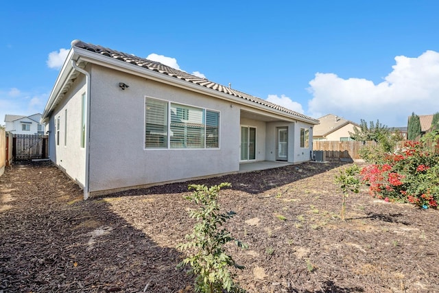 back of house featuring a patio and central AC