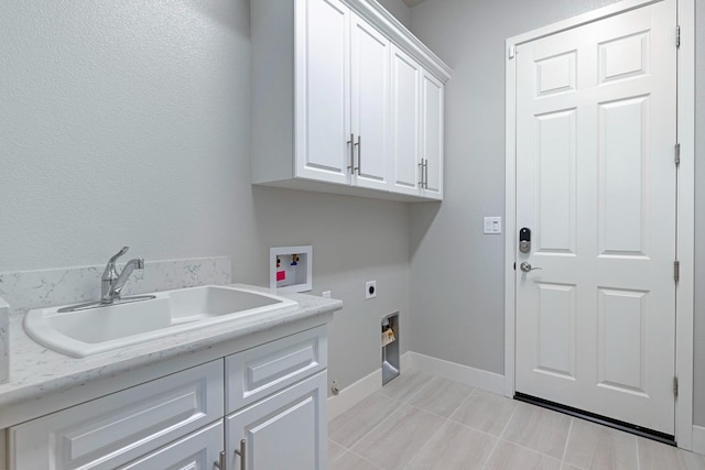 laundry room with cabinets, light tile patterned floors, hookup for a washing machine, hookup for an electric dryer, and sink