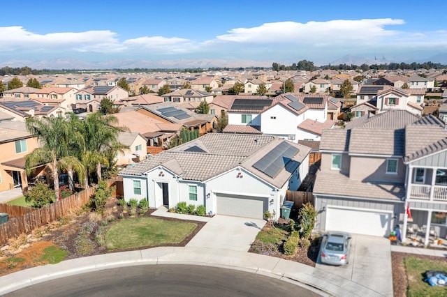 birds eye view of property with a mountain view