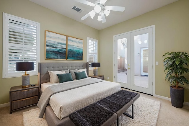 carpeted bedroom with french doors, ceiling fan, and access to outside