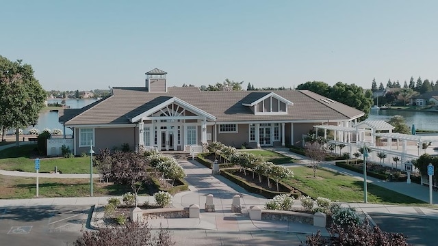 exterior space featuring a water view and french doors