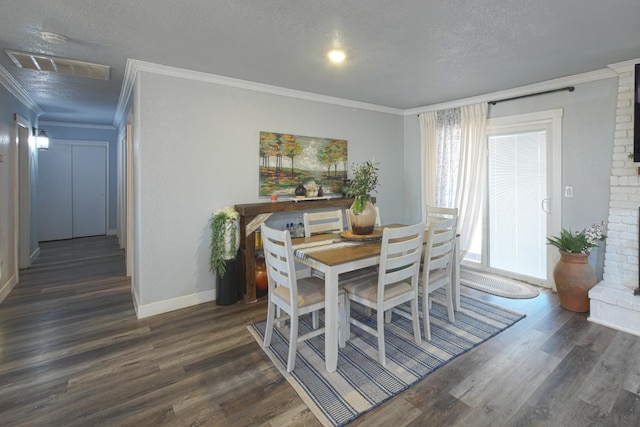 dining area with a textured ceiling, dark wood-type flooring, and a wealth of natural light