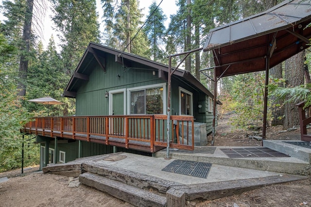 exterior space featuring a wooden deck