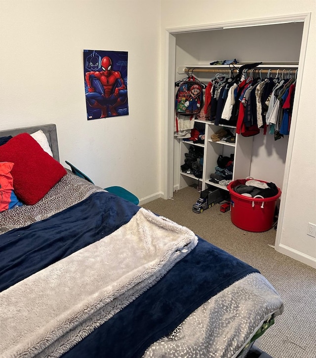 bedroom with a closet and carpet flooring