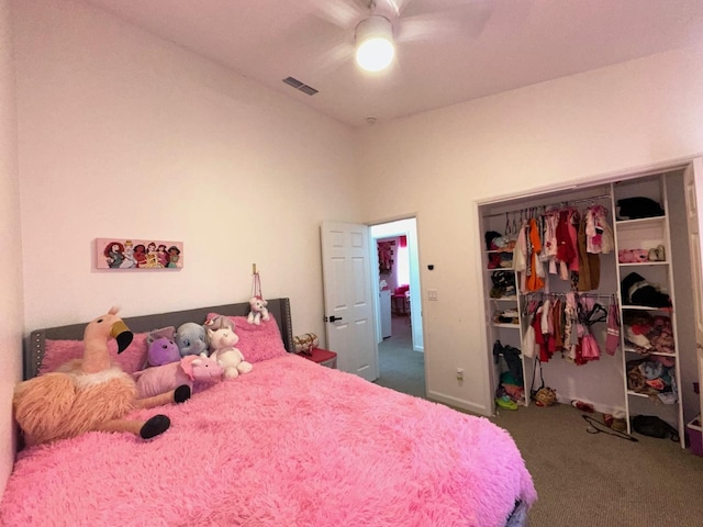 carpeted bedroom featuring a closet and ceiling fan