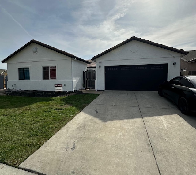 ranch-style house with a front yard and a garage