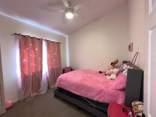 carpeted bedroom featuring lofted ceiling and ceiling fan