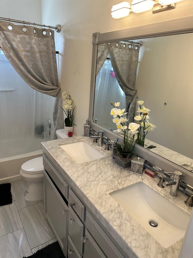 full bathroom with vanity, toilet, and shower / bath combo