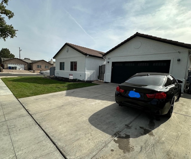 ranch-style house with a front lawn and a garage