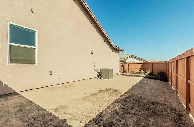 view of side of property with cooling unit