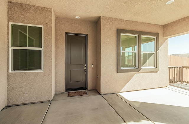 doorway to property featuring a patio