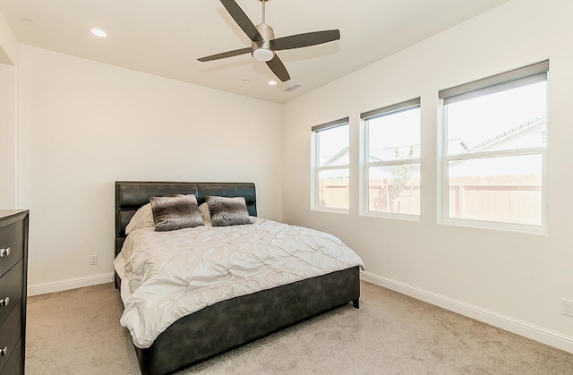 bedroom featuring ceiling fan and light colored carpet