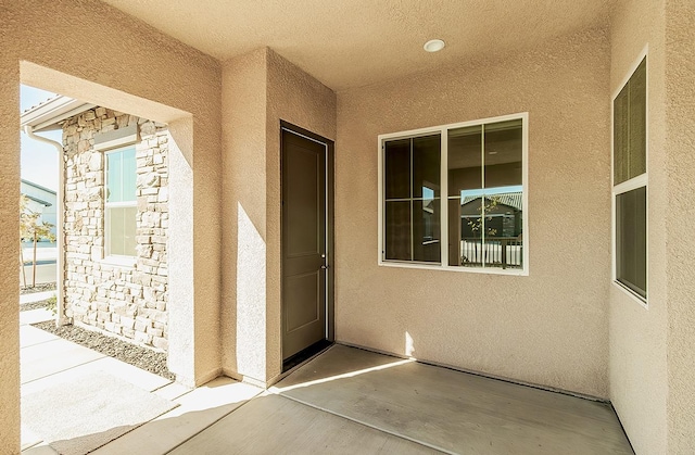 property entrance featuring a patio