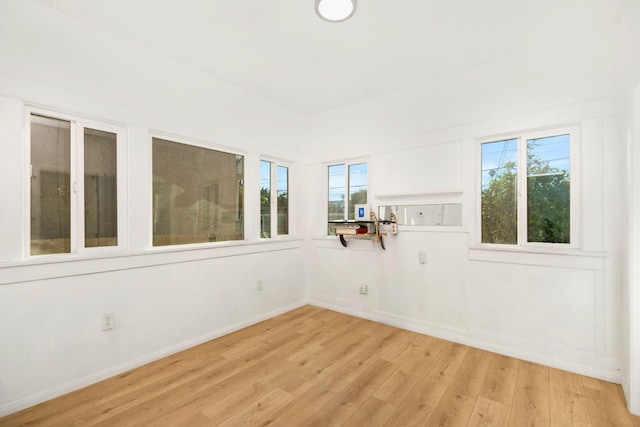 unfurnished room with light hardwood / wood-style floors